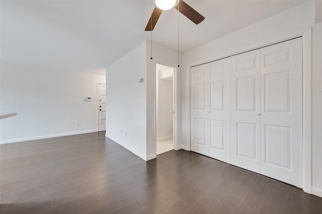 4325 Madera Rd, Irving, TX 75038 - unfurnished bedroom with dark wood-style flooring, baseboards, a closet, and a ceiling fan
