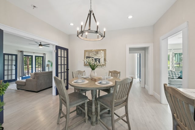 702 Griffith, Terrell, TX 75160 - dining room with light wood finished floors, a chandelier, recessed lighting, baseboards, and french doors