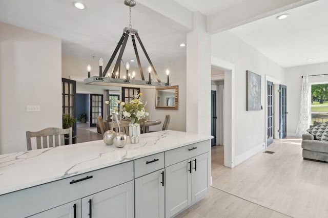 702 Griffith, Terrell, TX 75160 - kitchen with open floor plan, light stone counters, light wood-type flooring, recessed lighting, and baseboards