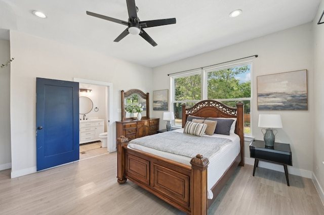 702 Griffith, Terrell, TX 75160 - bedroom with light wood-style flooring, baseboards, ensuite bath, recessed lighting, and a ceiling fan