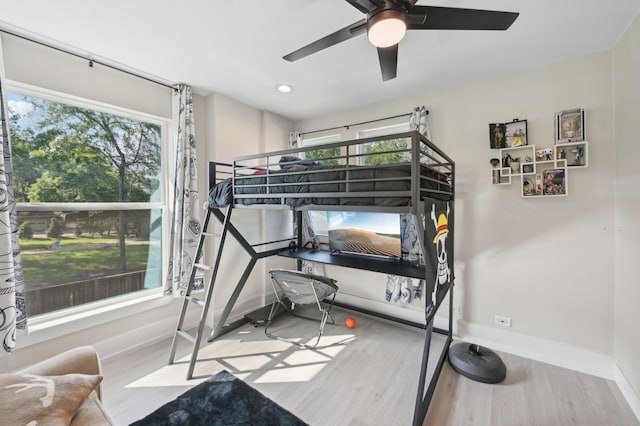 702 Griffith, Terrell, TX 75160 - bedroom with wood finished floors, baseboards, ceiling fan, and recessed lighting