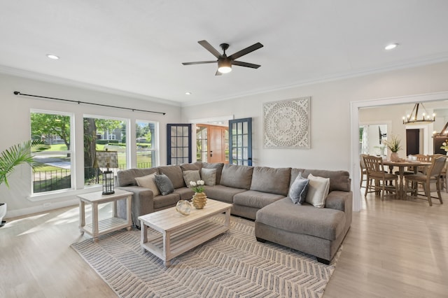 702 Griffith, Terrell, TX 75160 - living area featuring crown molding, light wood-type flooring, a ceiling fan, recessed lighting, and a chandelier