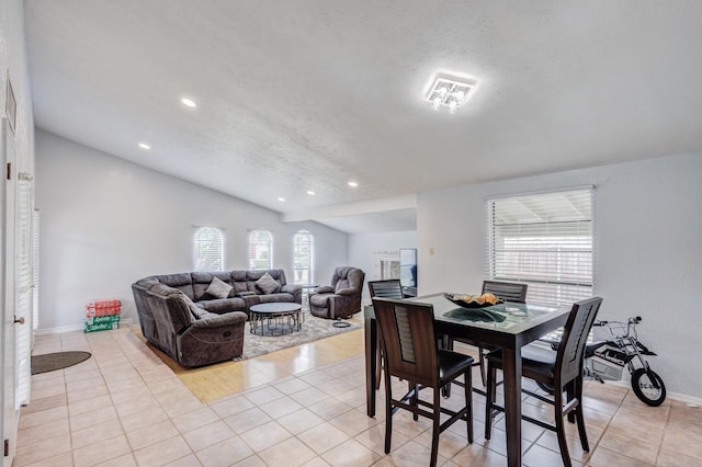 3110 Nutmeg Ln, Garland, TX 75044 - dining area featuring lofted ceiling, light tile patterned flooring, a textured ceiling, recessed lighting, and baseboards