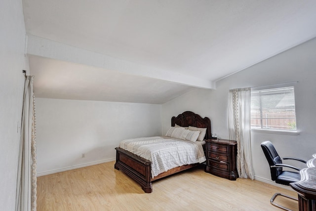 3110 Nutmeg Ln, Garland, TX 75044 - bedroom with lofted ceiling, wood finished floors, and baseboards
