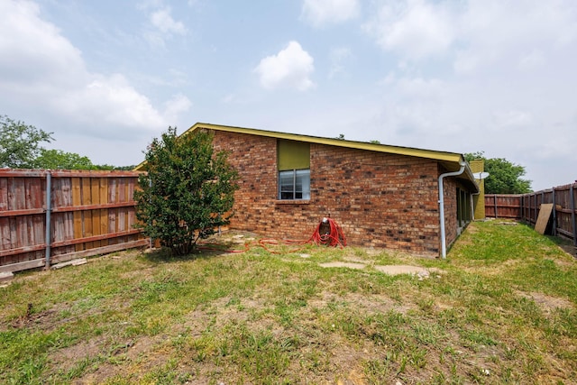 3110 Nutmeg Ln, Garland, TX 75044 - rear view of property featuring a fenced backyard and brick siding