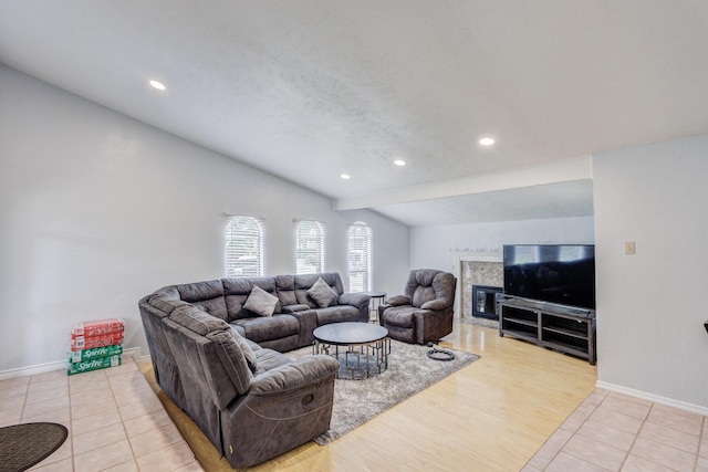 3110 Nutmeg Ln, Garland, TX 75044 - living room with lofted ceiling, a high end fireplace, light tile patterned floors, baseboards, and recessed lighting