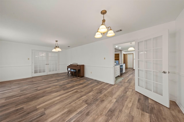 1812 Trinity Dr, Waco, TX 76710 - unfurnished room with french doors and wood finished floors