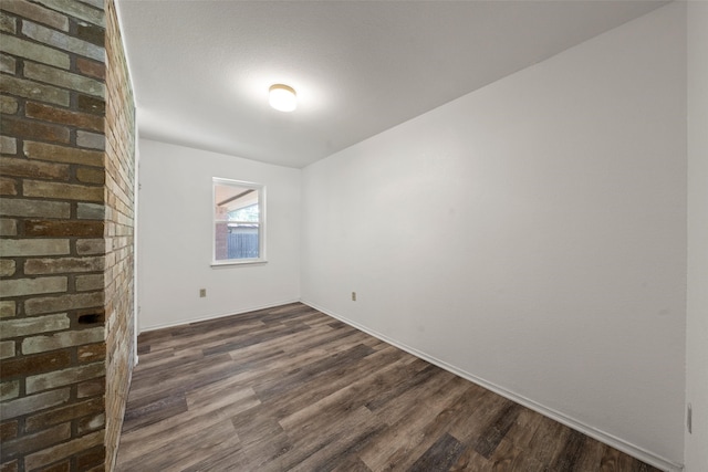 1812 Trinity Dr, Waco, TX 76710 - unfurnished room with dark wood-style floors and baseboards
