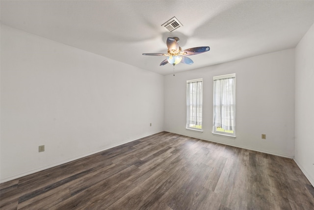1812 Trinity Dr, Waco, TX 76710 - empty room with a ceiling fan, dark wood-style floors, and baseboards