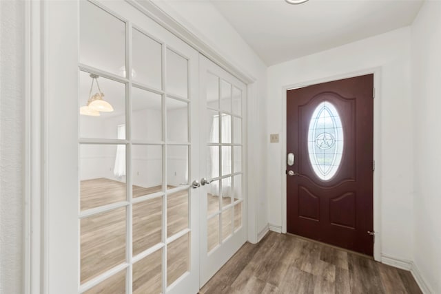1812 Trinity Dr, Waco, TX 76710 - foyer featuring french doors, wood finished floors, and baseboards