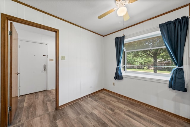 1812 Trinity Dr, Waco, TX 76710 - spare room featuring crown molding, wood finished floors, baseboards, and a ceiling fan