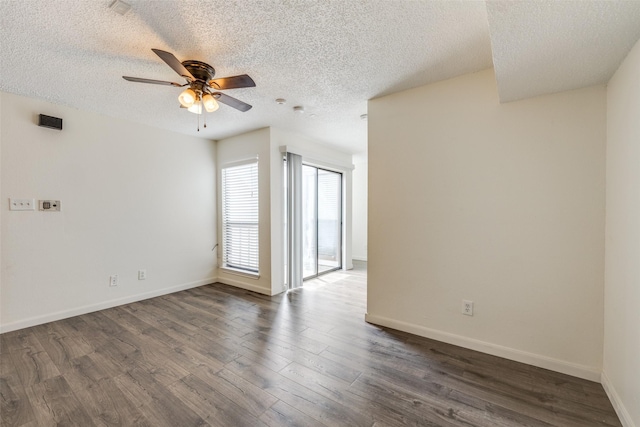 2301 Balsam Dr Unit F308, Arlington, TX 76006 - empty room featuring a ceiling fan, a textured ceiling, dark wood-style floors, and baseboards