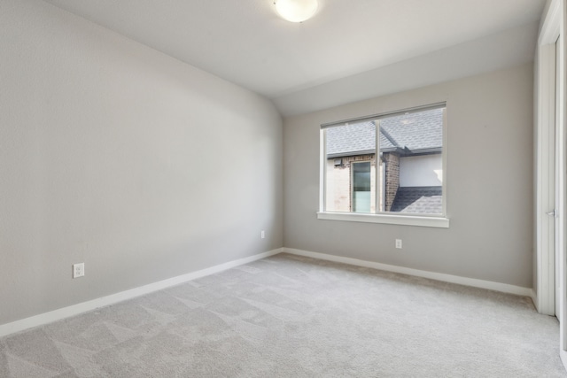 3967 Sanders Dr, Celina, TX 75009 - spare room featuring light carpet, baseboards, and vaulted ceiling