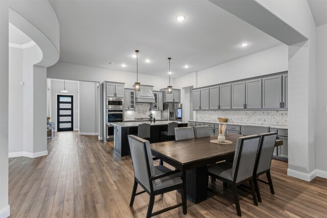 1318 Middleton Dr, Rockwall, TX 75087 - dining room featuring dark wood-type flooring, recessed lighting, and baseboards