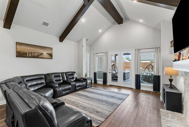 1318 Middleton Dr, Rockwall, TX 75087 - living room with beamed ceiling, french doors, wood finished floors, high vaulted ceiling, and recessed lighting