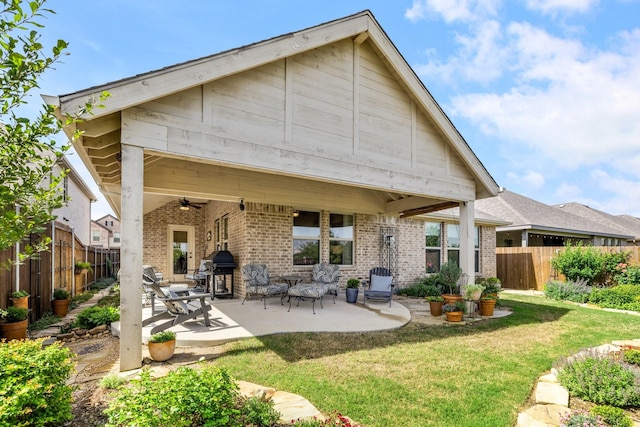 821 Mildren Ln, Fate, TX 75087 - back of house with a ceiling fan, brick siding, and a patio