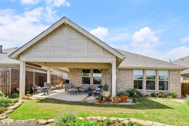 821 Mildren Ln, Fate, TX 75087 - back of house featuring brick siding, a patio area, a shingled roof, and a gazebo