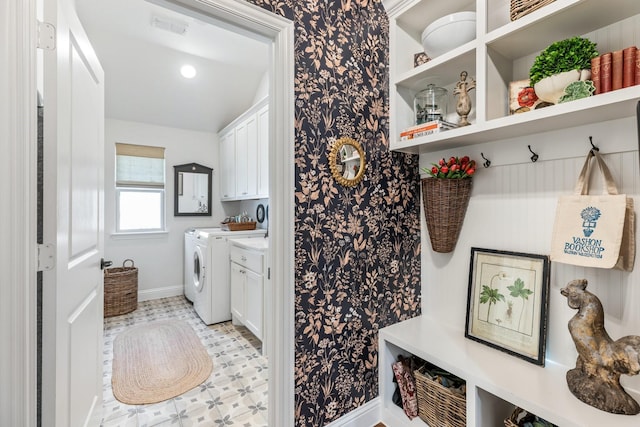 821 Mildren Ln, Fate, TX 75087 - washroom with cabinet space, baseboards, independent washer and dryer, and light flooring