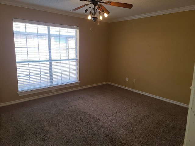 empty room with ceiling fan, crown molding, baseboards, and carpet floors