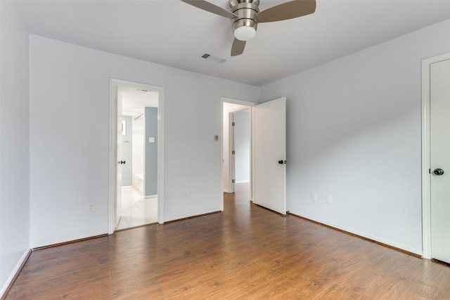 2330 Kennington Dr Unit D, Arlington, TX 76012 - unfurnished bedroom featuring wood finished floors, baseboards, and a ceiling fan
