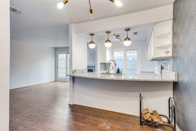2330 Kennington Dr Unit D, Arlington, TX 76012 - kitchen with a sink, wood finished floors, range, open shelves, and light stone counters
