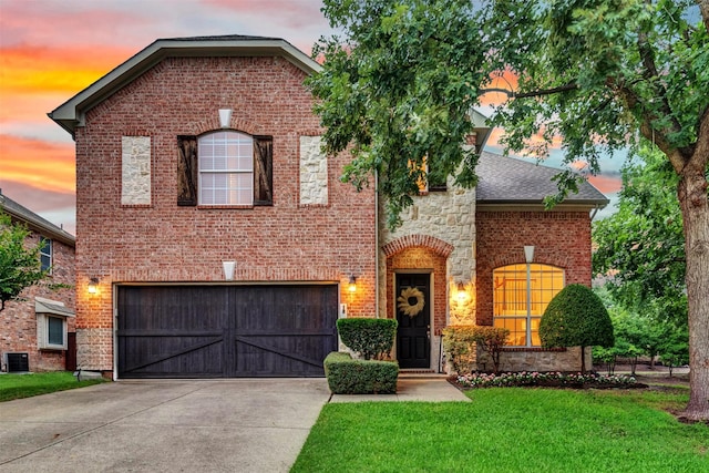 1600 Templegate Dr, Mckinney, TX 75072 - view of front facade featuring an attached garage, driveway, brick siding, and a front lawn