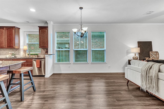 1600 Templegate Dr, Mckinney, TX 75072 - kitchen featuring dishwasher, open floor plan, dark wood-style flooring, ornamental molding, and a chandelier