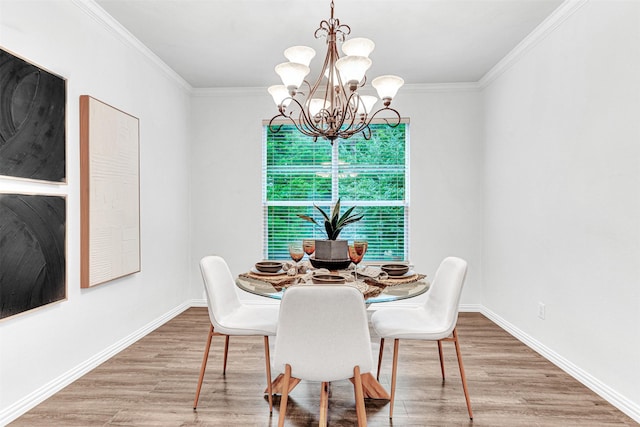 1600 Templegate Dr, Mckinney, TX 75072 - dining area featuring a chandelier, wood finished floors, ornamental molding, and baseboards