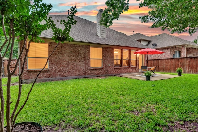 1600 Templegate Dr, Mckinney, TX 75072 - rear view of house with a patio area, brick siding, a chimney, and a shingled roof