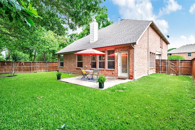 1600 Templegate Dr, Mckinney, TX 75072 - rear view of house featuring a chimney, a patio area, brick siding, and a shingled roof