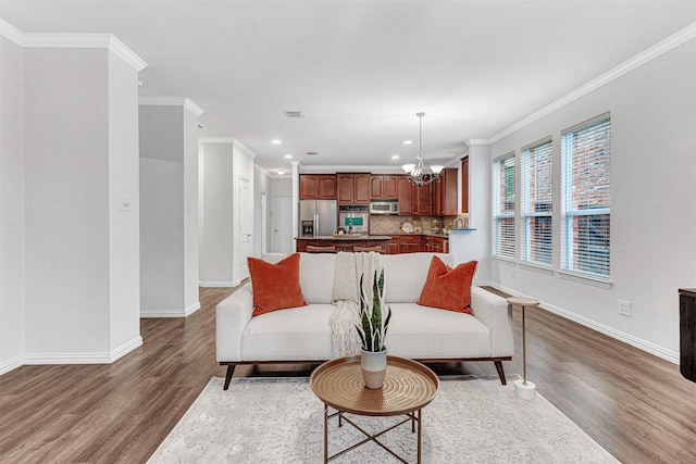 1600 Templegate Dr, Mckinney, TX 75072 - living area featuring crown molding, wood finished floors, a chandelier, baseboards, and recessed lighting