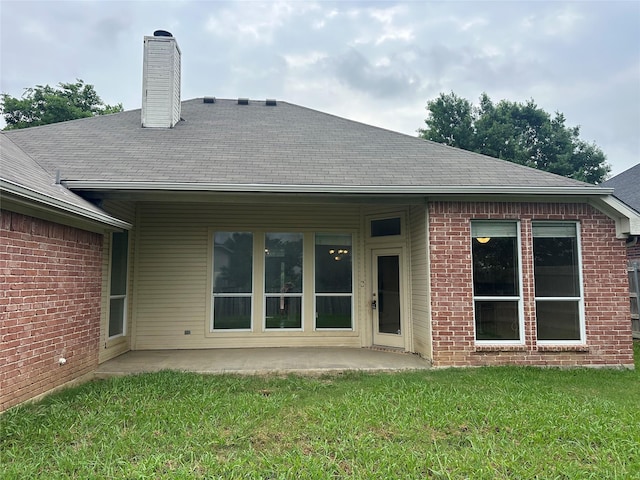 803 W Lonesome Dove Trl, Arlington, TX 76001 - rear view of property featuring a yard, a patio area, brick siding, and roof with shingles