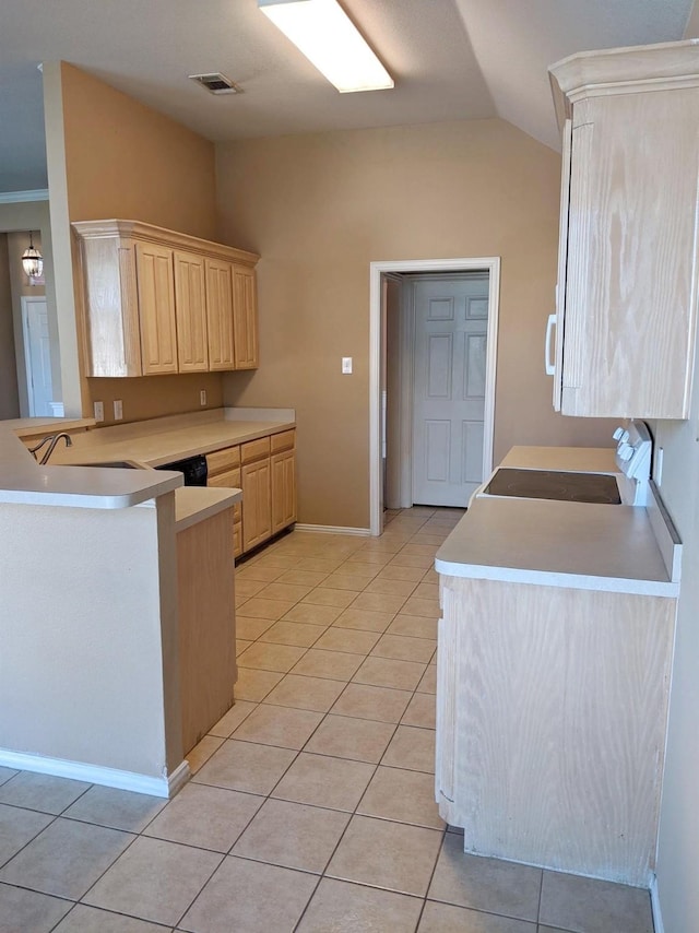 803 W Lonesome Dove Trl, Arlington, TX 76001 - kitchen with vaulted ceiling, light brown cabinets, light tile patterned floors, light countertops, and a peninsula