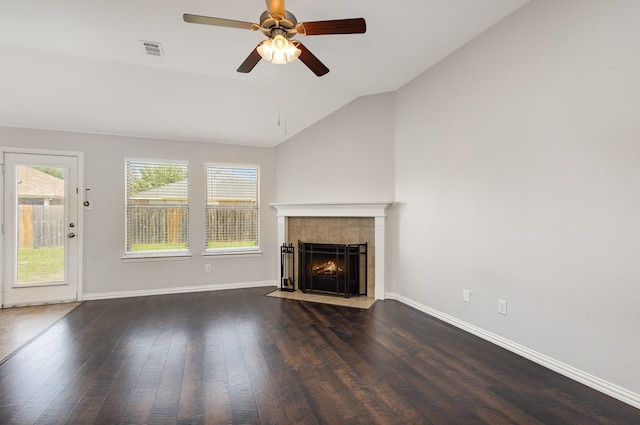 213 Longhorn Dr, Waxahachie, TX 75165 - unfurnished living room featuring vaulted ceiling, a fireplace, ceiling fan, baseboards, and wood finished floors