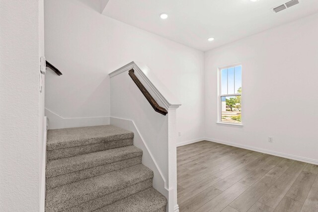 1126 Bexar Ln, Plano, TX 75075 - stairs with wood finished floors, recessed lighting, and baseboards