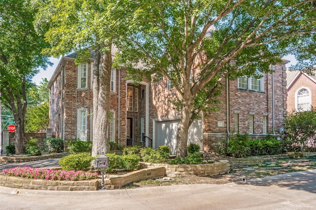 2 Birchmont Ln, Dallas, TX 75230 - view of front of house featuring brick siding and an attached garage