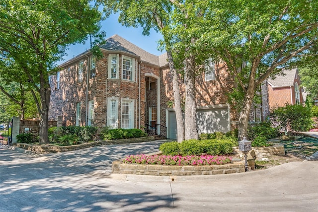 2 Birchmont Ln, Dallas, TX 75230 - view of front of home with brick siding, concrete driveway, and a garage