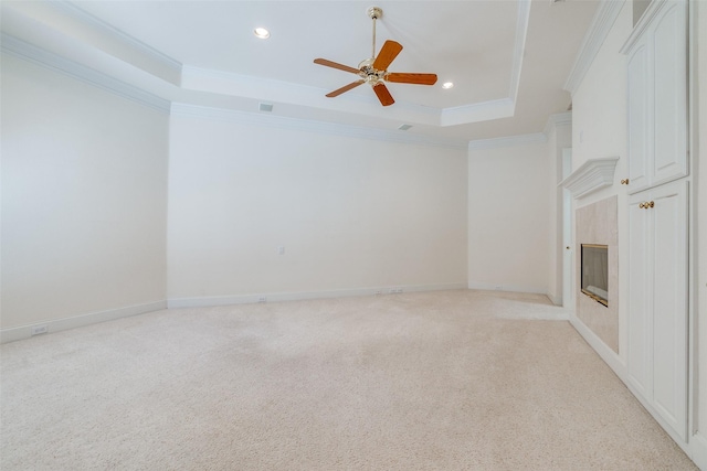 2 Birchmont Ln, Dallas, TX 75230 - unfurnished living room featuring a tray ceiling, a ceiling fan, ornamental molding, recessed lighting, and light carpet