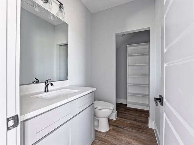 6223 Post Oak Ter, Fort Worth, TX 76112 - bathroom with toilet, wood finished floors, and vanity