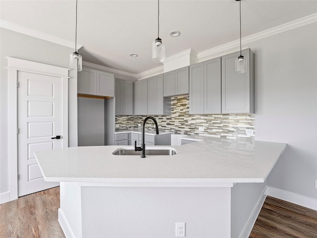 6223 Post Oak Ter, Fort Worth, TX 76112 - kitchen featuring gray cabinetry, a sink, ornamental molding, decorative backsplash, and wood finished floors