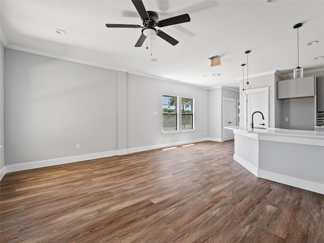 6223 Post Oak Ter, Fort Worth, TX 76112 - unfurnished living room with ornamental molding, wood finished floors, a sink, baseboards, and ceiling fan