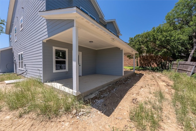 6223 Post Oak Ter, Fort Worth, TX 76112 - view of side of home featuring covered porch