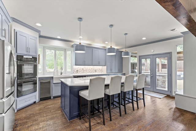 755 Richmond Ln, Keller, TX 76248 - kitchen featuring stainless steel refrigerator with ice dispenser, a sink, ornamental molding, light countertops, and a center island