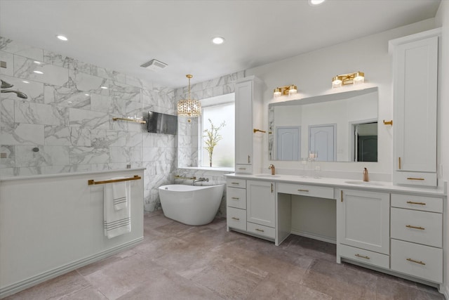 755 Richmond Ln, Keller, TX 76248 - full bath featuring a freestanding tub, a walk in shower, double vanity, tile walls, and recessed lighting