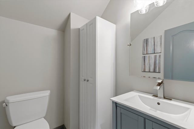 755 Richmond Ln, Keller, TX 76248 - bathroom featuring toilet, vanity, and vaulted ceiling