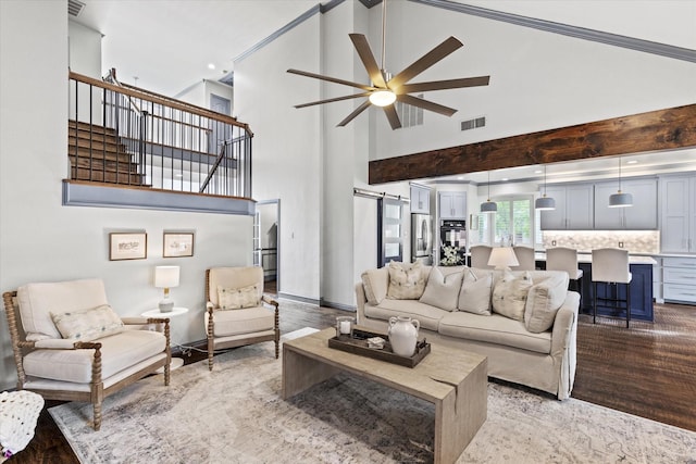 755 Richmond Ln, Keller, TX 76248 - living area with a ceiling fan, a high ceiling, light wood-style flooring, and stairs