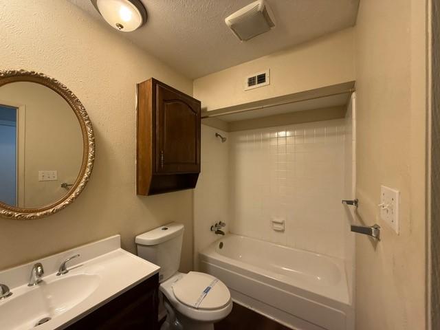 828 Wood Gln, Desoto, TX 75115 - bathroom with toilet, vanity, and  shower combination