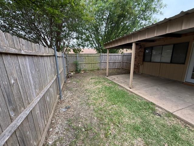 828 Wood Gln, Desoto, TX 75115 - fenced backyard with a patio area