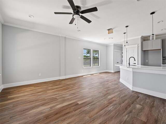 6221 Post Oak Ter, Fort Worth, TX 76112 - unfurnished living room with ornamental molding, wood finished floors, a sink, baseboards, and ceiling fan