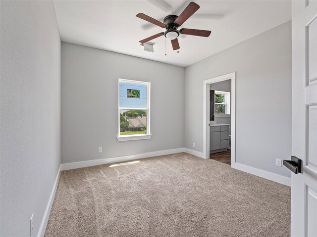 6221 Post Oak Ter, Fort Worth, TX 76112 - empty room featuring dark carpet, ceiling fan, and baseboards